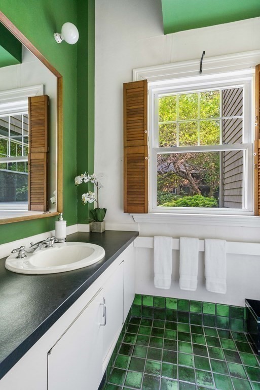 24 Percy Road Lexington, MA 02421 - Photo 17 of 38 a bathroom with a granite countertop sink and a window