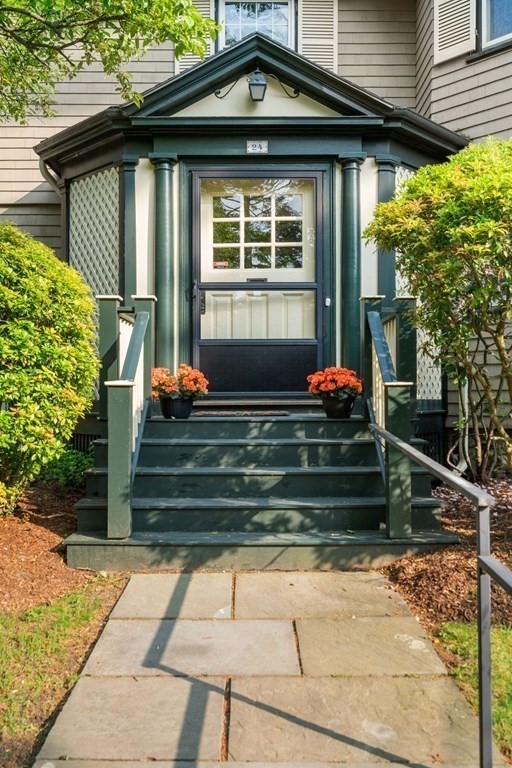 24 Percy Road Lexington, MA 02421 - Photo 2 of 38 a front view of a house with a yard