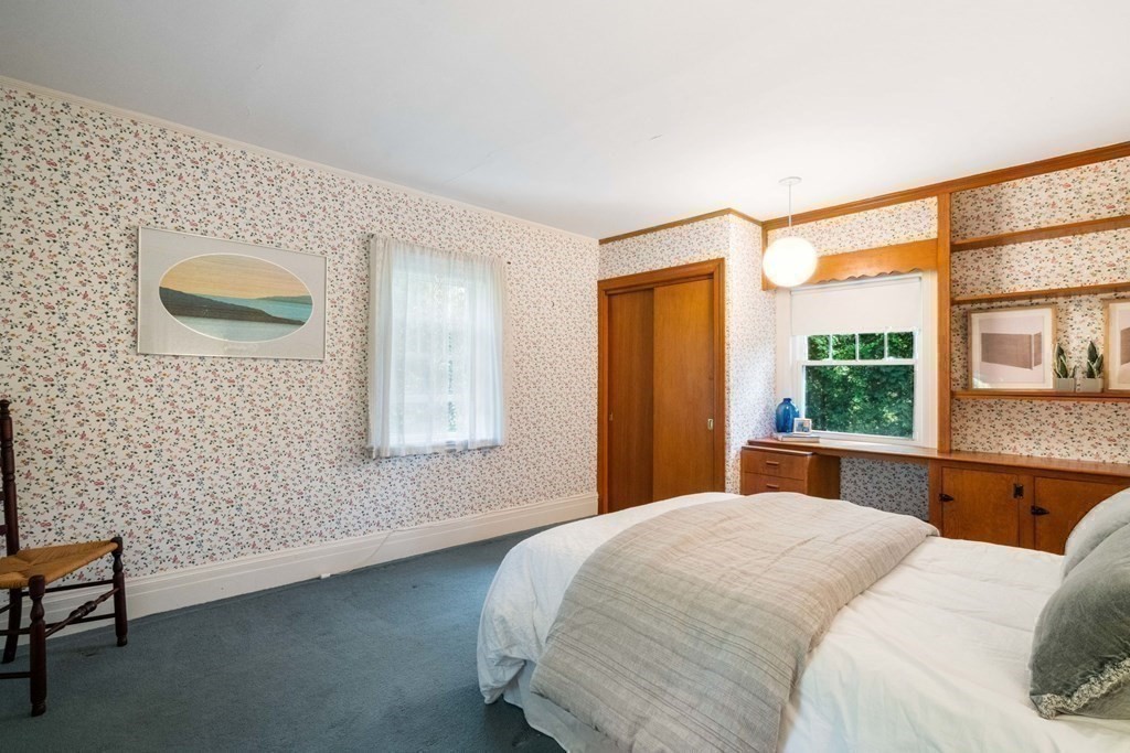 24 Percy Road Lexington, MA 02421 - Photo 23 of 38 a bedroom with a large bed and a large window