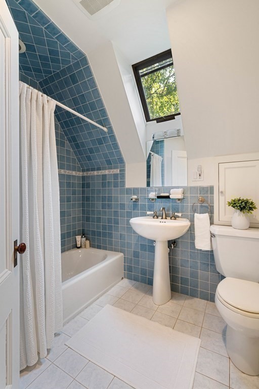 24 Percy Road Lexington, MA 02421 - Photo 27 of 38 a bathroom with a sink toilet and shower