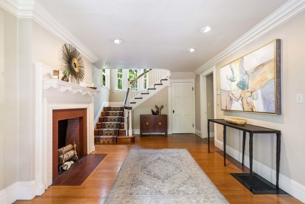 24 Percy Road Lexington, MA 02421 - Photo 3 of 38 a living room with furniture and a fireplace