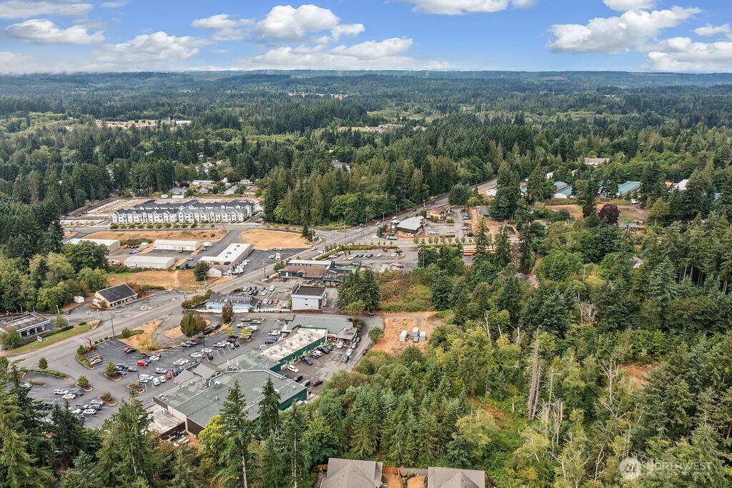 26516 Lindvog Road Northeast Kingston, WA 98346 - Photo 10 of 19 an aerial view of residential houses with outdoor space and trees