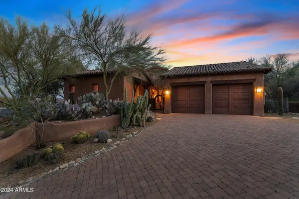 a view of a porch with furniture and a yard