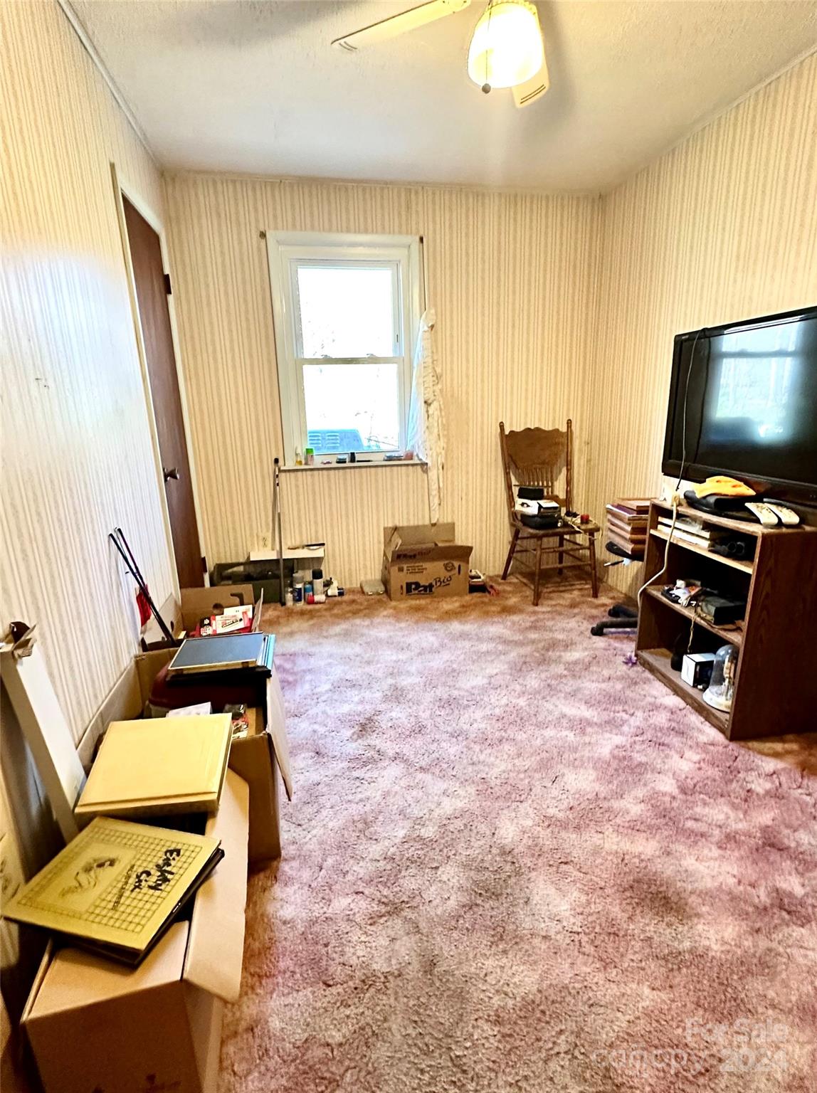 186 Stiles Road Waynesville, NC 28786 - Photo 15 of 18 a room with furniture and a flat screen tv