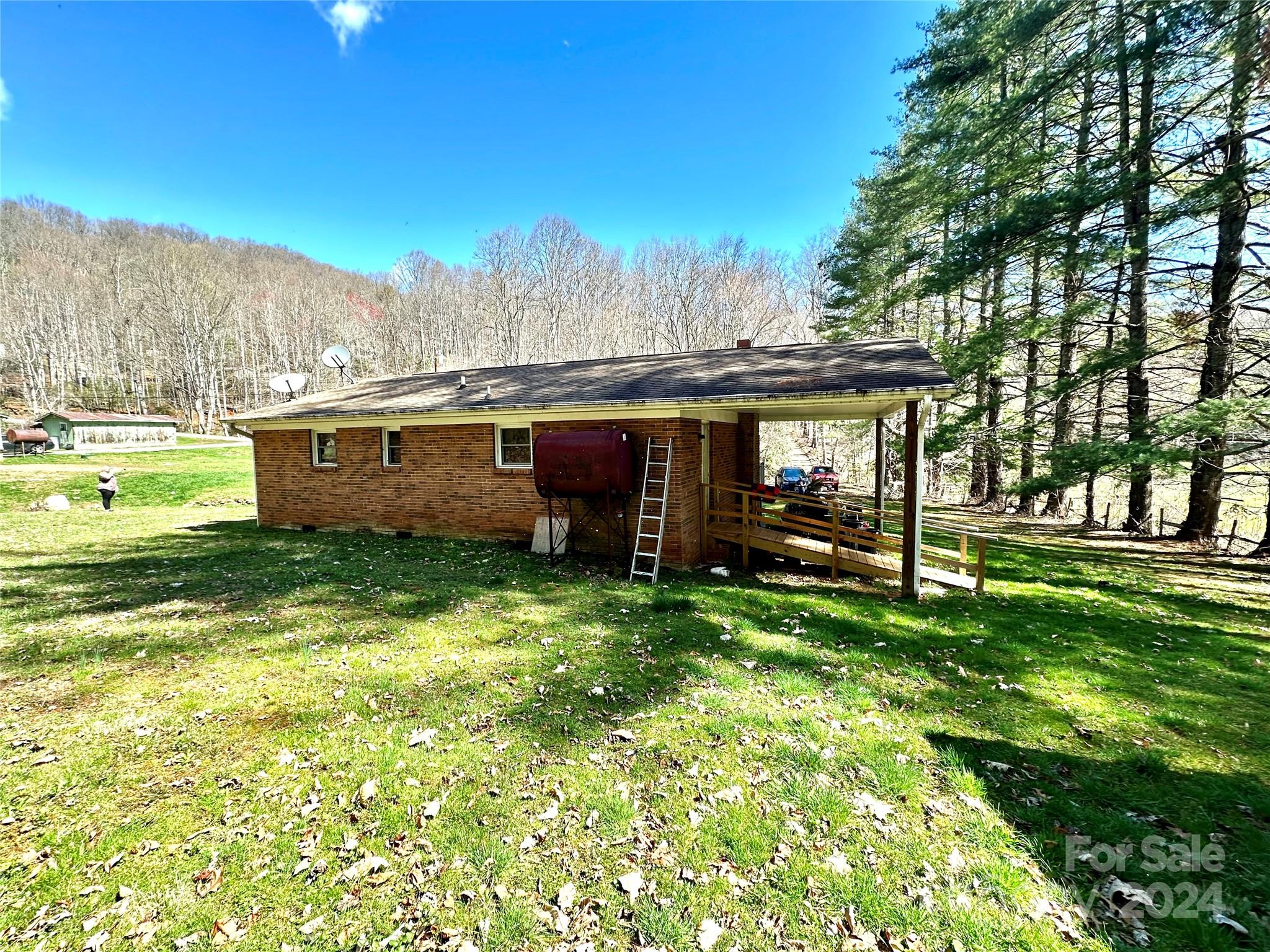 186 Stiles Road Waynesville, NC 28786 - Photo 18 of 18 a view of a house with a yard