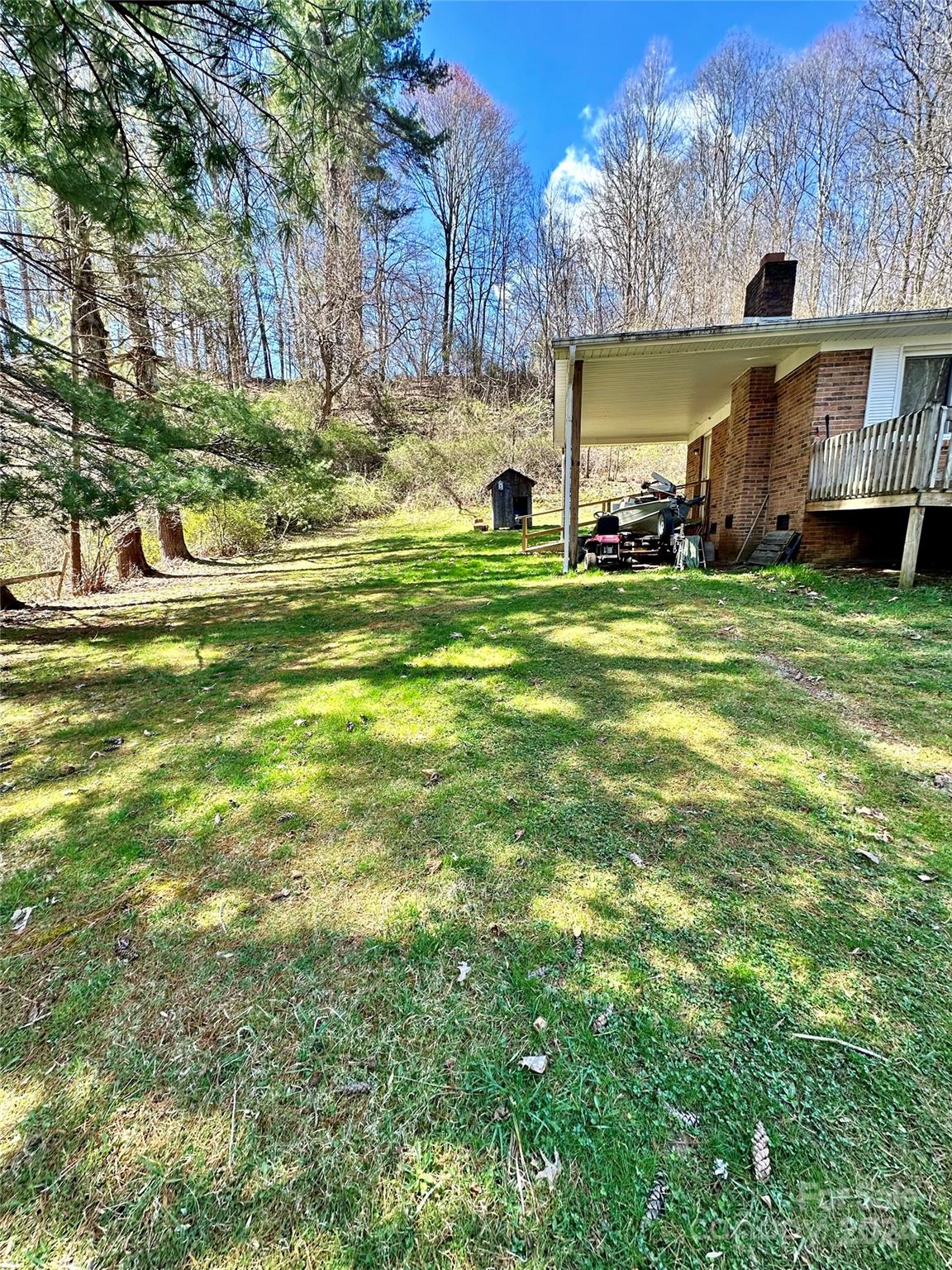 186 Stiles Road Waynesville, NC 28786 - Photo 3 of 18 a swimming pool with outdoor seating and yard