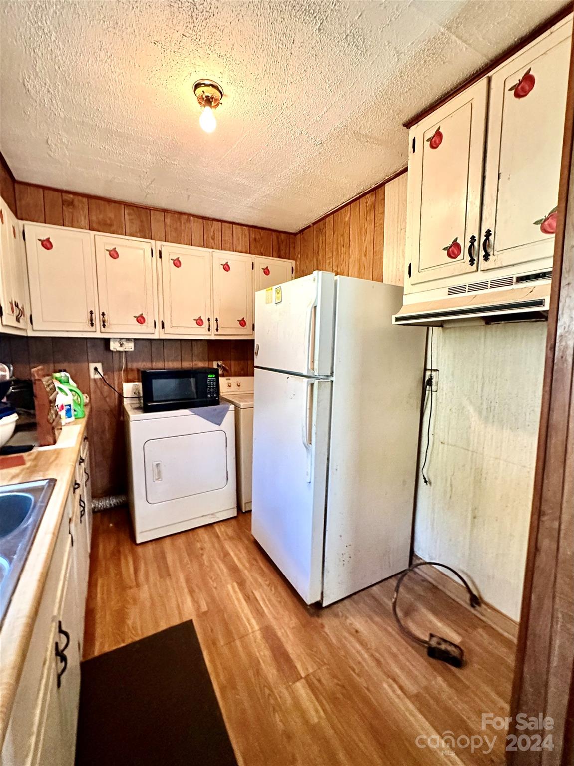 186 Stiles Road Waynesville, NC 28786 - Photo 8 of 18 a kitchen with stainless steel appliances a refrigerator and a stove