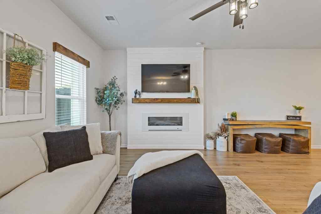 60 Huntley Trace Hoschton, GA 30548 - Photo 17 of 50 a bedroom with furniture and a fireplace