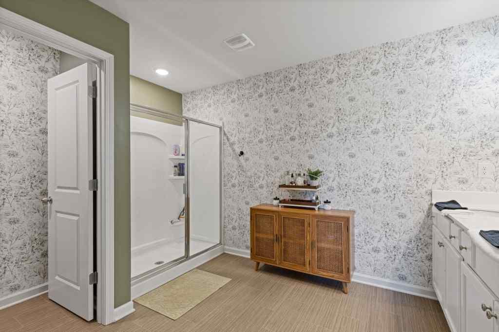 60 Huntley Trace Hoschton, GA 30548 - Photo 27 of 50 a kitchen with stainless steel appliances granite countertop a stove and a refrigerator