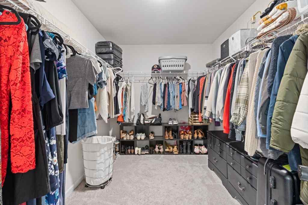 60 Huntley Trace Hoschton, GA 30548 - Photo 31 of 50 a view of walk in closet with clothes and shoes