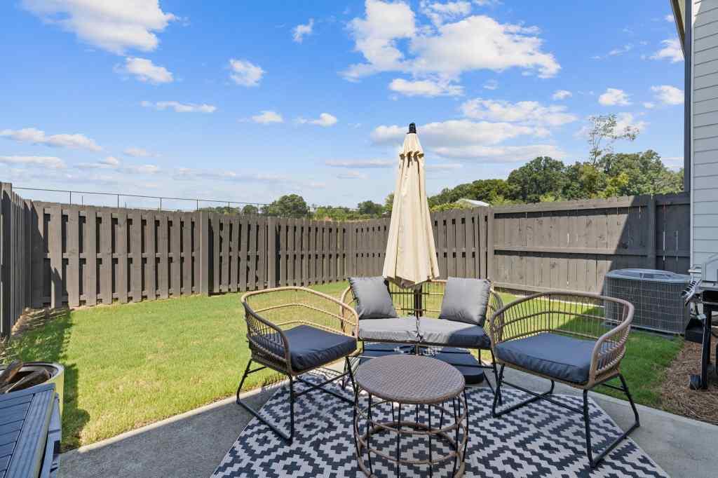 60 Huntley Trace Hoschton, GA 30548 - Photo 39 of 50 a view of a chairs and table in patio
