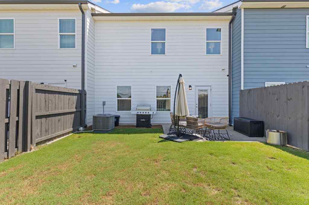 60 Huntley Trace Hoschton, GA 30548 - Photo 41 of 50 a view of a house with backyard and sitting area