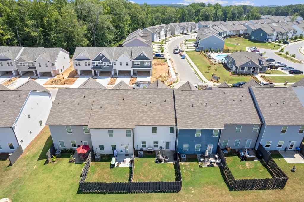 60 Huntley Trace Hoschton, GA 30548 - Photo 43 of 50 an aerial view of a house with swimming pool and large trees