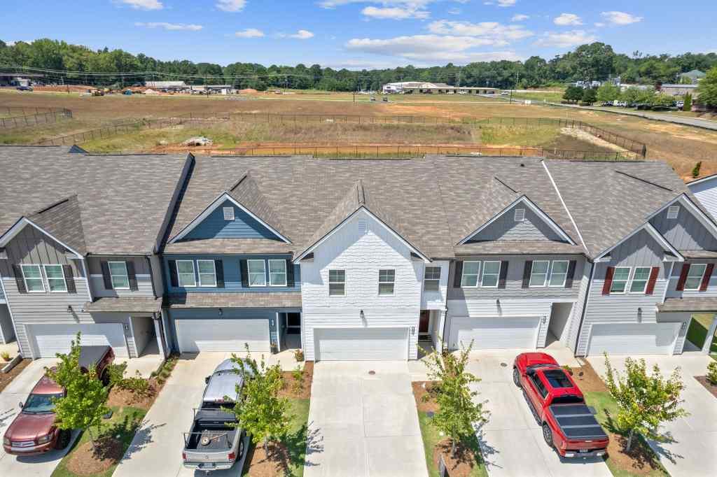 60 Huntley Trace Hoschton, GA 30548 - Photo 44 of 50 a aerial view of a house with a lake view