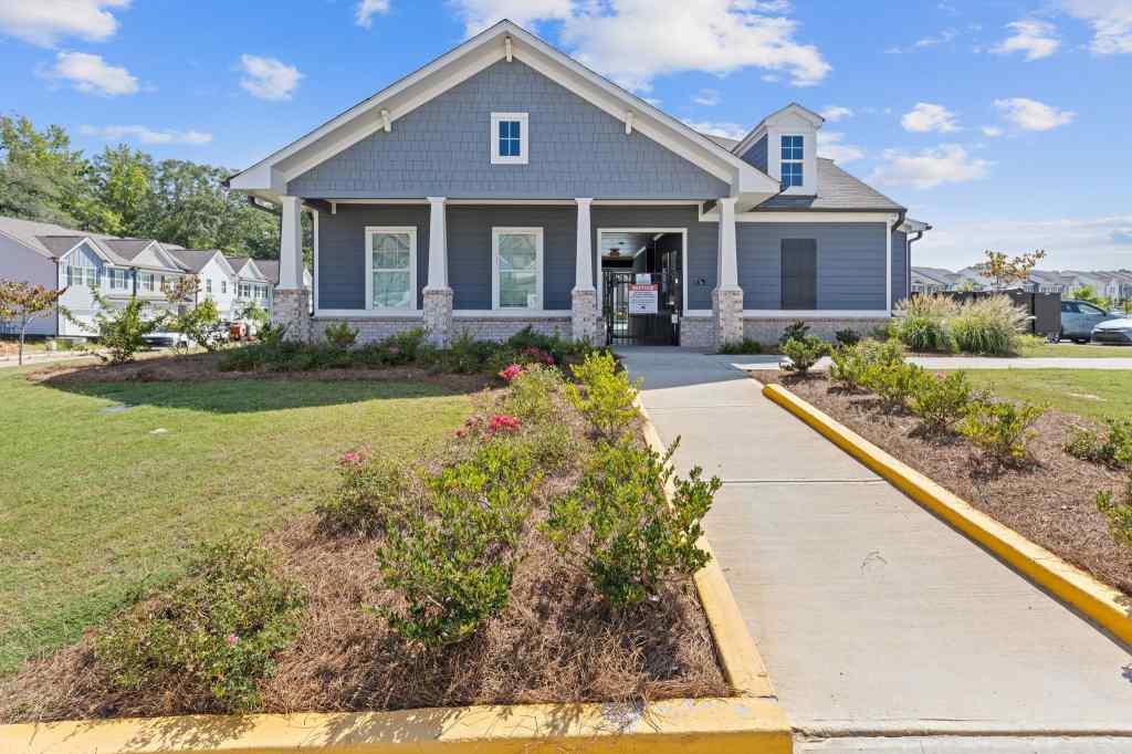 60 Huntley Trace Hoschton, GA 30548 - Photo 48 of 50 a front view of a house with garden