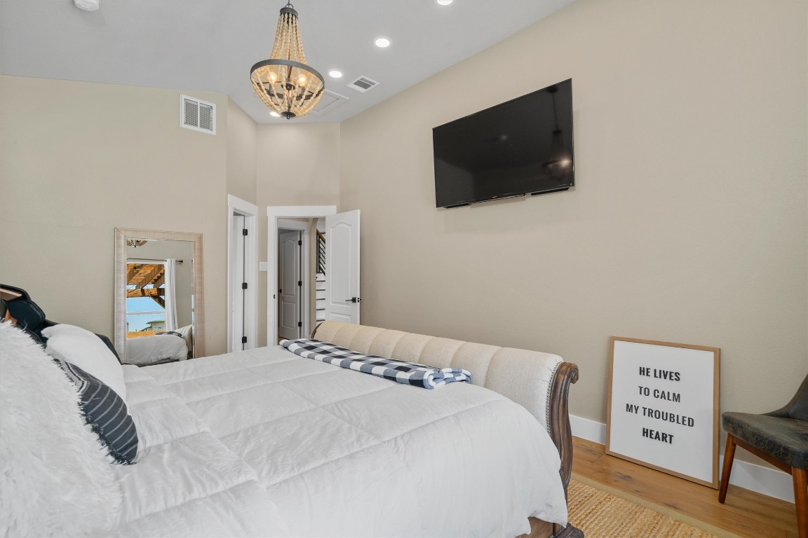 542 Centerbrook Place Round Rock, TX 78665 - Photo 17 of 40 a bedroom with a bed and a flat screen tv