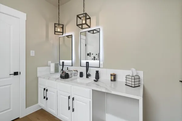a bathroom with a sink and a mirror