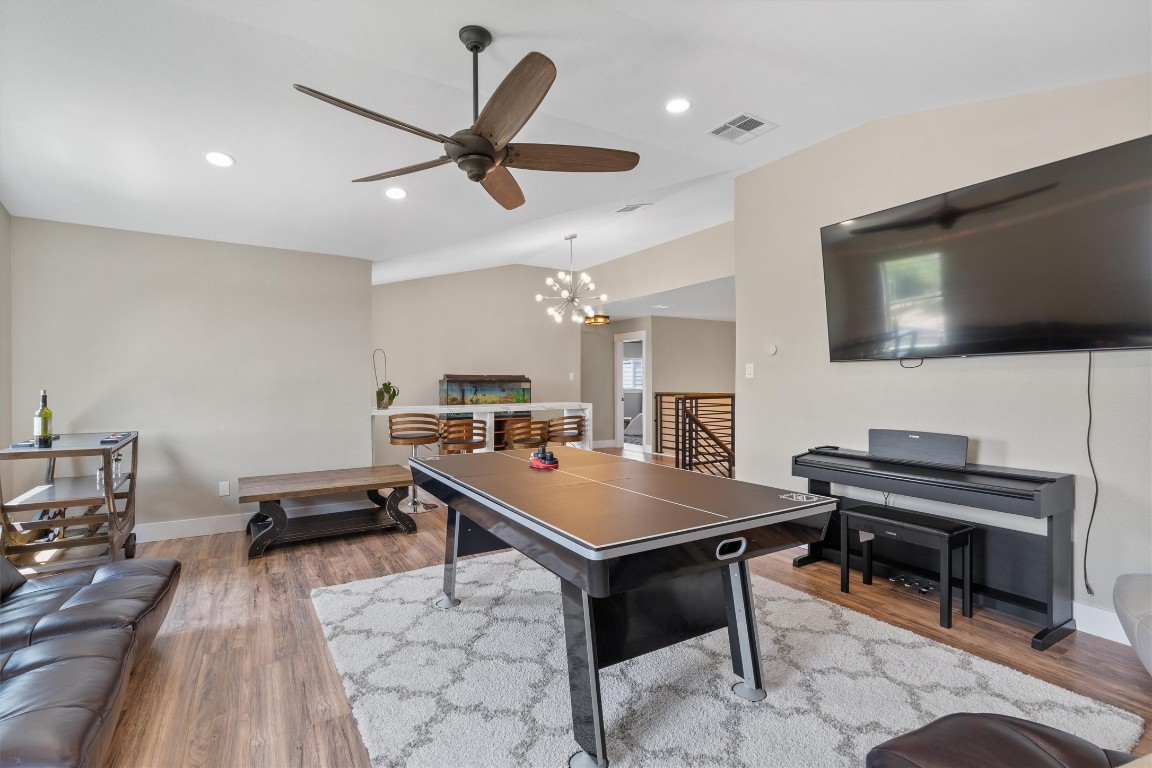 542 Centerbrook Place Round Rock, TX 78665 - Photo 24 of 40 a room with furniture and a flat screen tv