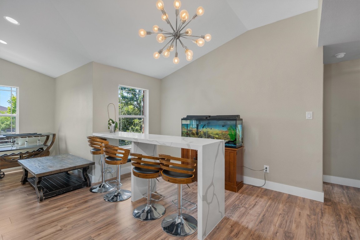 542 Centerbrook Place Round Rock, TX 78665 - Photo 25 of 40 a living room with furniture and a wooden floor