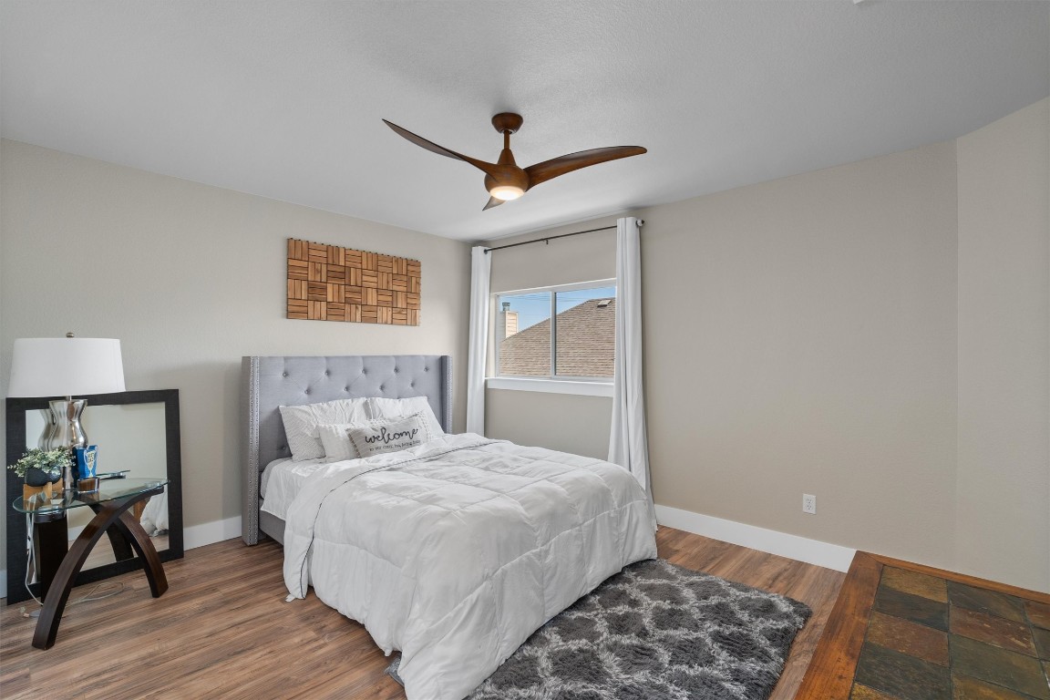 542 Centerbrook Place Round Rock, TX 78665 - Photo 28 of 40 a bedroom with a large bed and a window