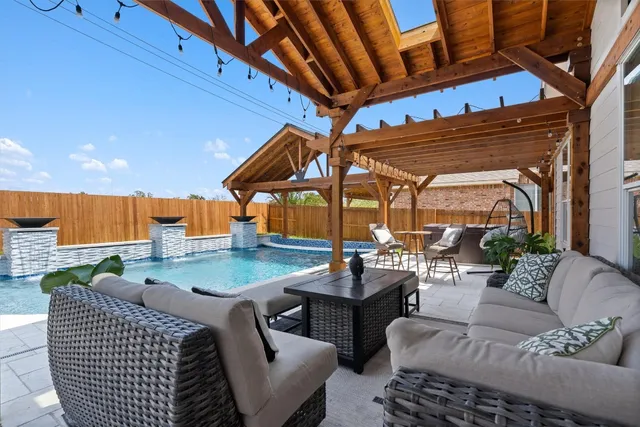 a outdoor space with patio couches table and chairs with potted plants