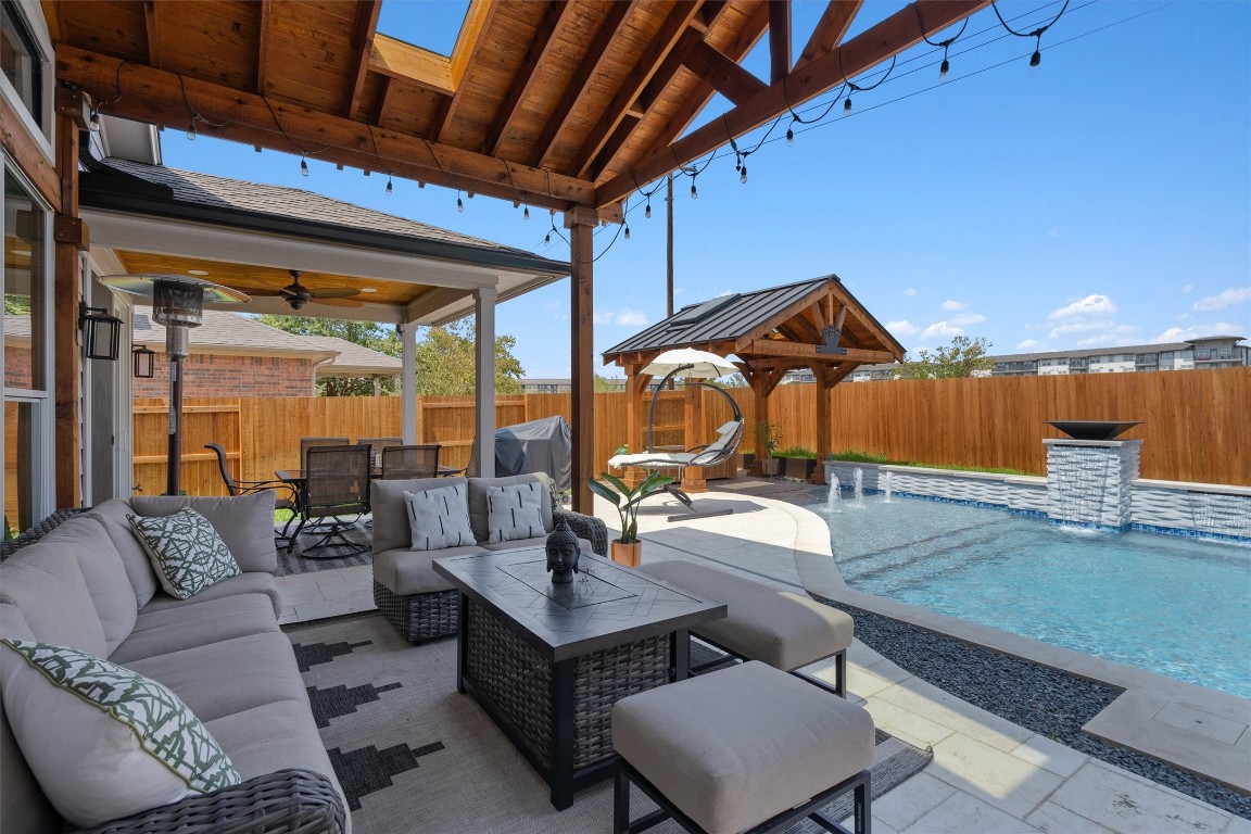 542 Centerbrook Place Round Rock, TX 78665 - Photo 33 of 40 a living room with furniture and a wooden floor