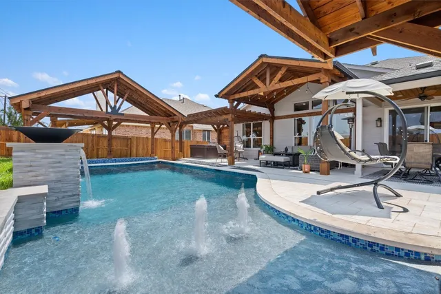 a view of a house with swimming pool