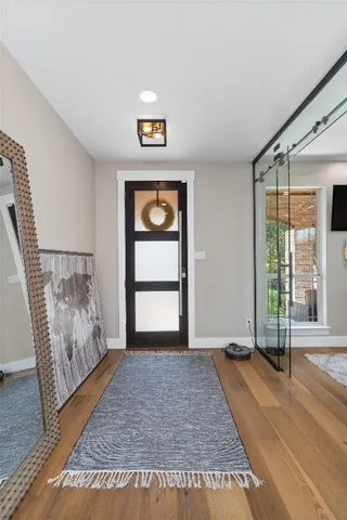 a view of empty room with window and front door