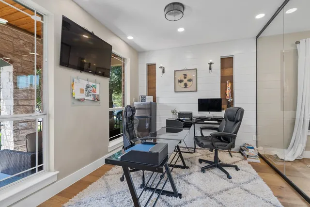 a view of a livingroom with workspace and a couch