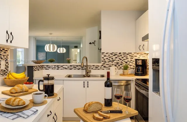 a kitchen with a stove and a refrigerator
