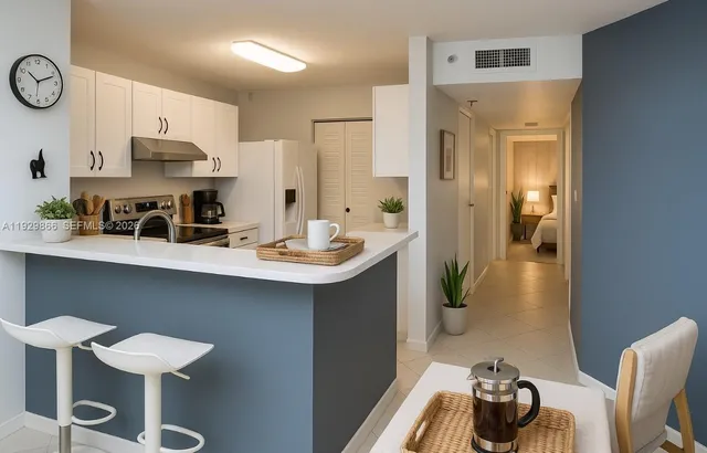a kitchen with a sink cabinets and appliances