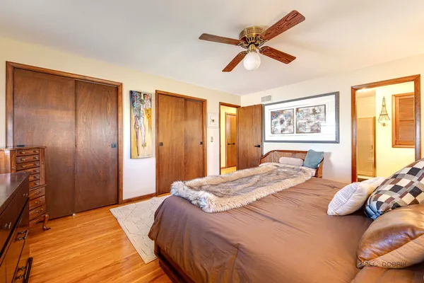 a bedroom with a bed and a dresser