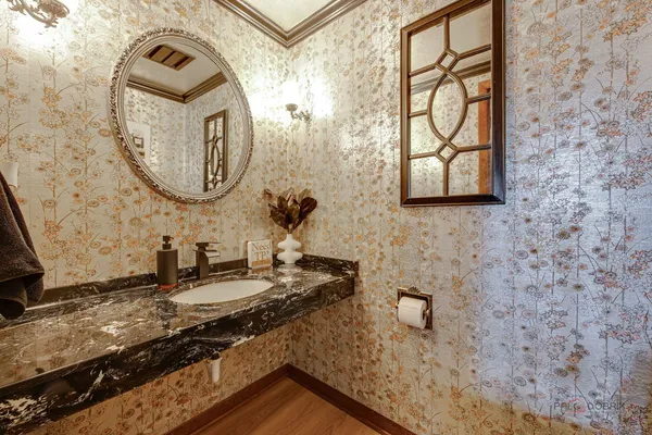 a bathroom with a mirror and a sink