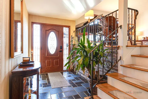 a view of entryway with wooden floor