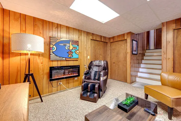 a room with furniture and musical instruments