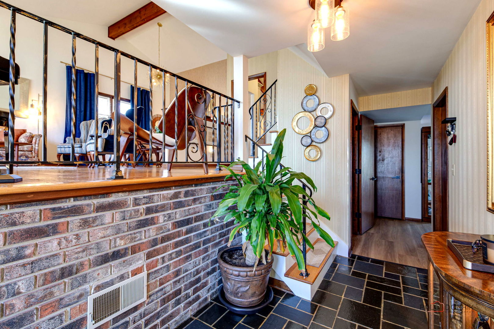 2042 South Goebbert Road Arlington Heights, IL 60005 - Photo 4 of 34 a potted plant sitting on a floor in front of a building