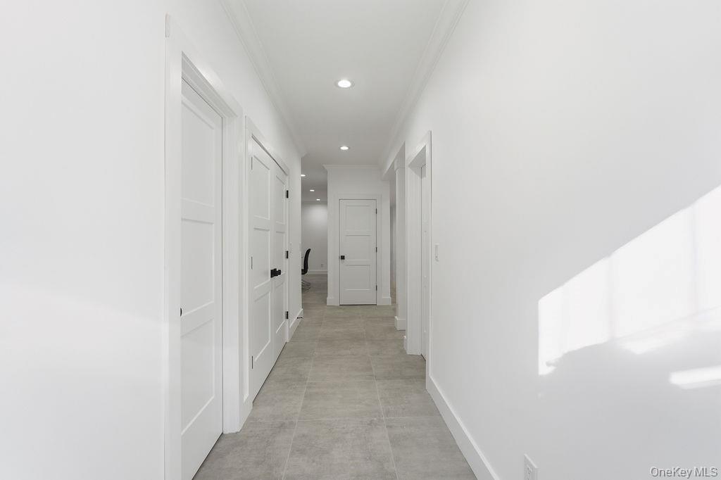 768 Bridgehampton Sag Harbor Bridgehampton, NY 11932 - Photo 33 of 35 Hall featuring crown molding and recessed lighting