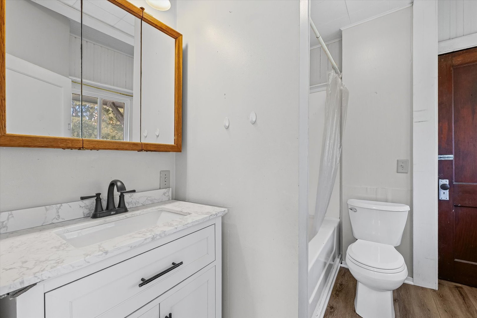 208 South Poplar Street Urbana, IL 61802 - Photo 13 of 30 a bathroom with a toilet sink and mirror
