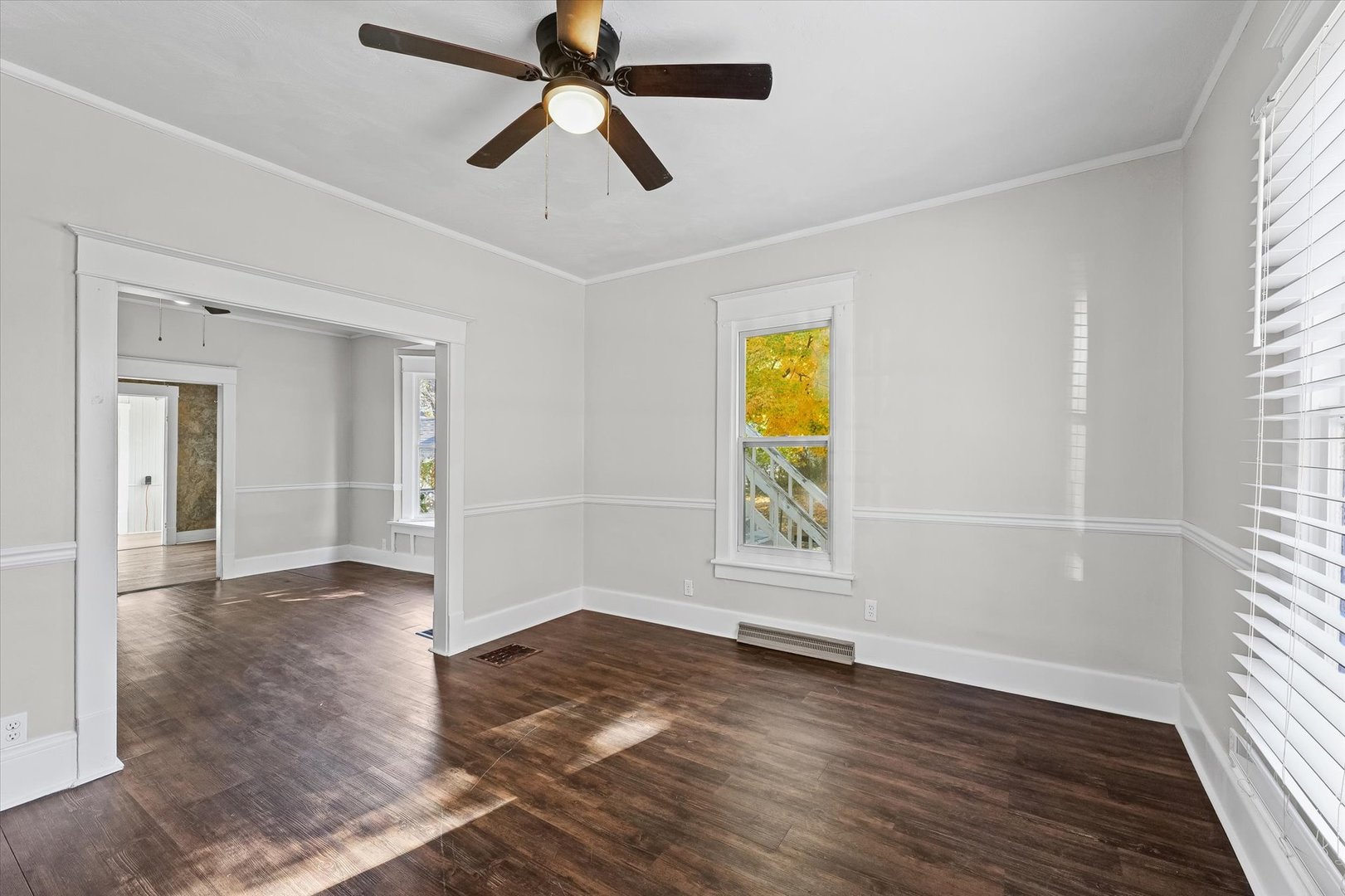 208 South Poplar Street Urbana, IL 61802 - Photo 4 of 30 wooden floor in an empty room with a window