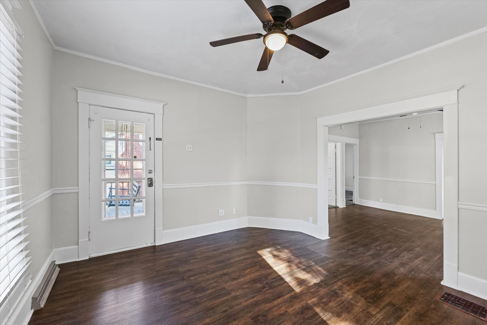 208 South Poplar Street Urbana, IL 61802 - Photo 5 of 30 wooden floor in an empty room with a window