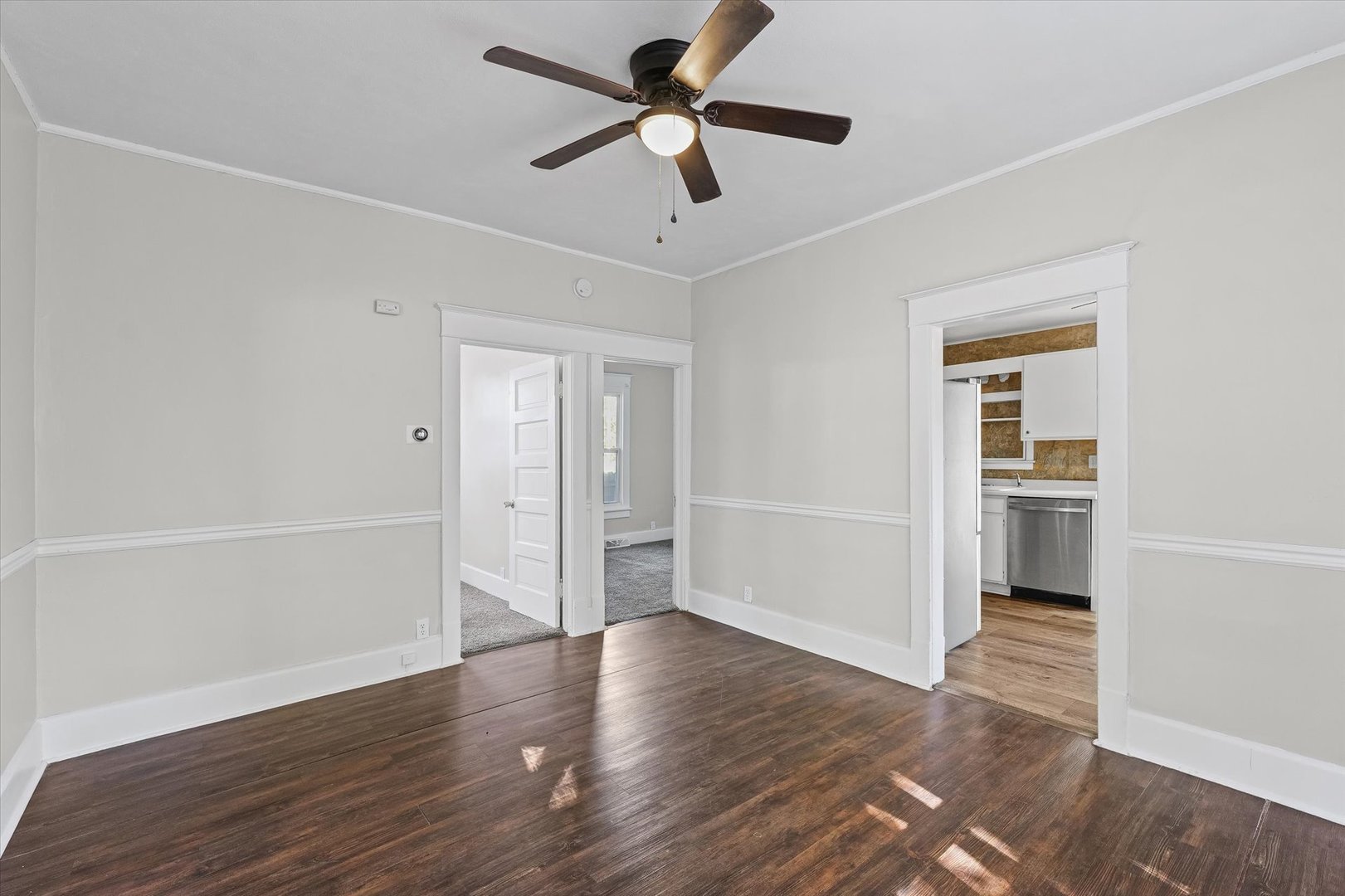 208 South Poplar Street Urbana, IL 61802 - Photo 8 of 30 a view of an empty room with a window and wooden floor