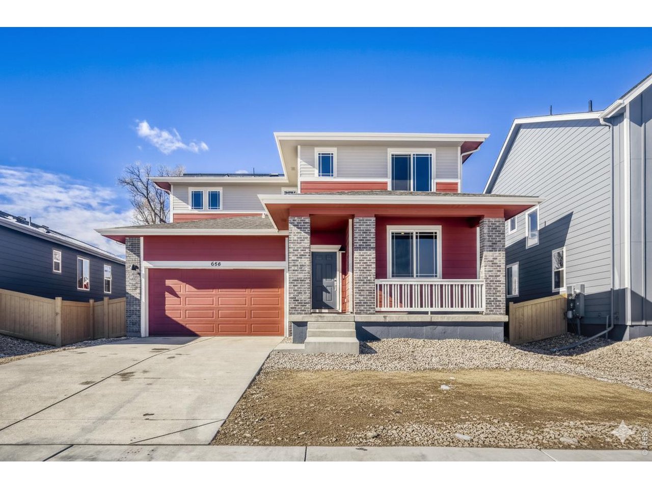 656 Noola Street Windsor, CO 80550 - Photo 20 of 33 a front view of a house with a garage