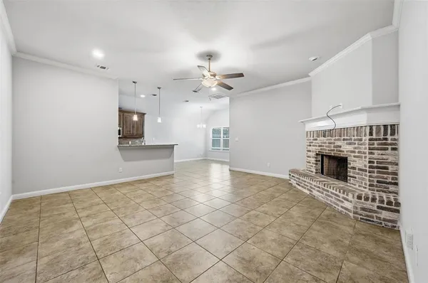 a view of an empty room with a fireplace