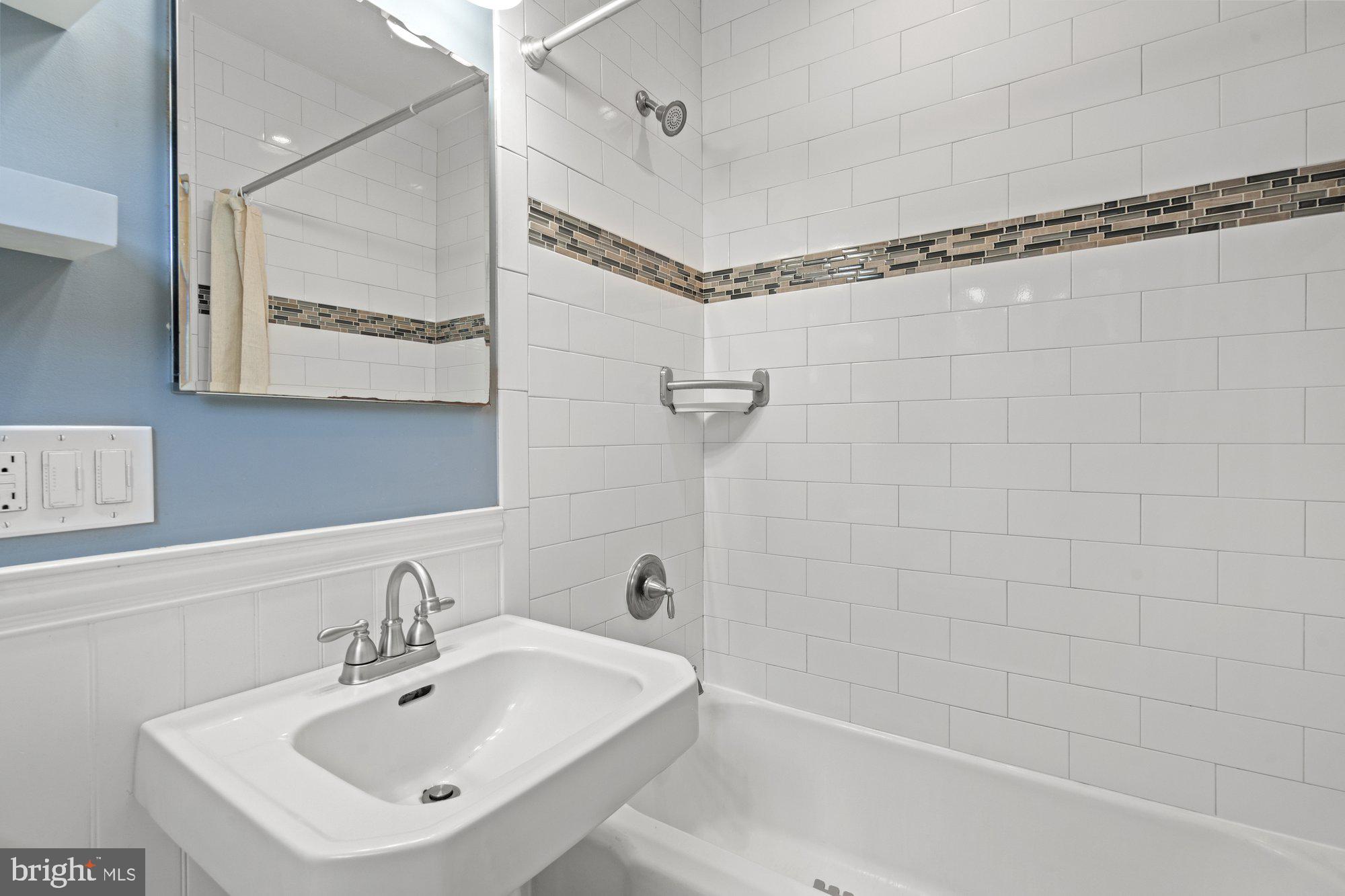3304 Gunston Road Alexandria, VA 22302 - Photo 17 of 28 a bathroom with a shower and a sink