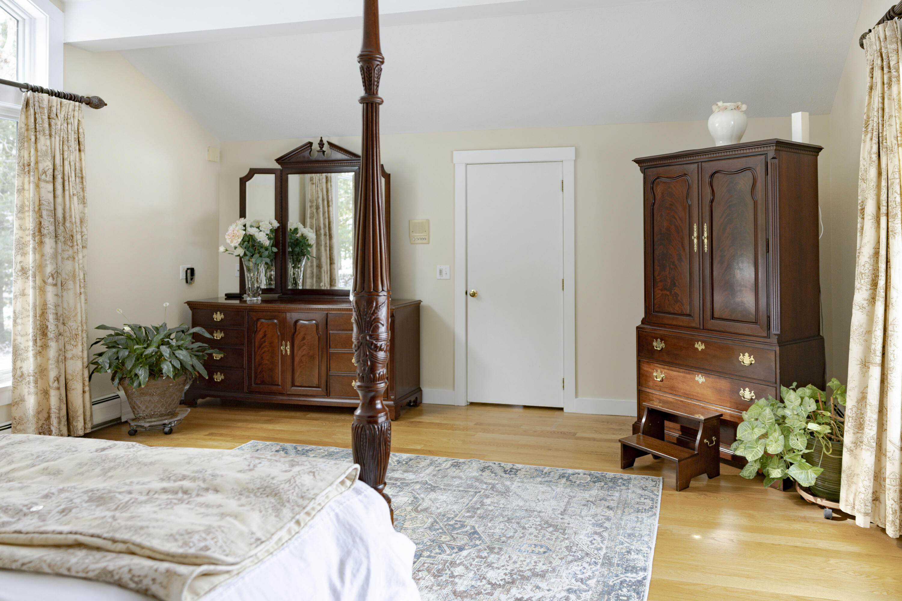 98 Bunker Hill Road Osterville, MA 02655 - Photo 44 of 88 a bedroom with a bed dresser and a potted plant