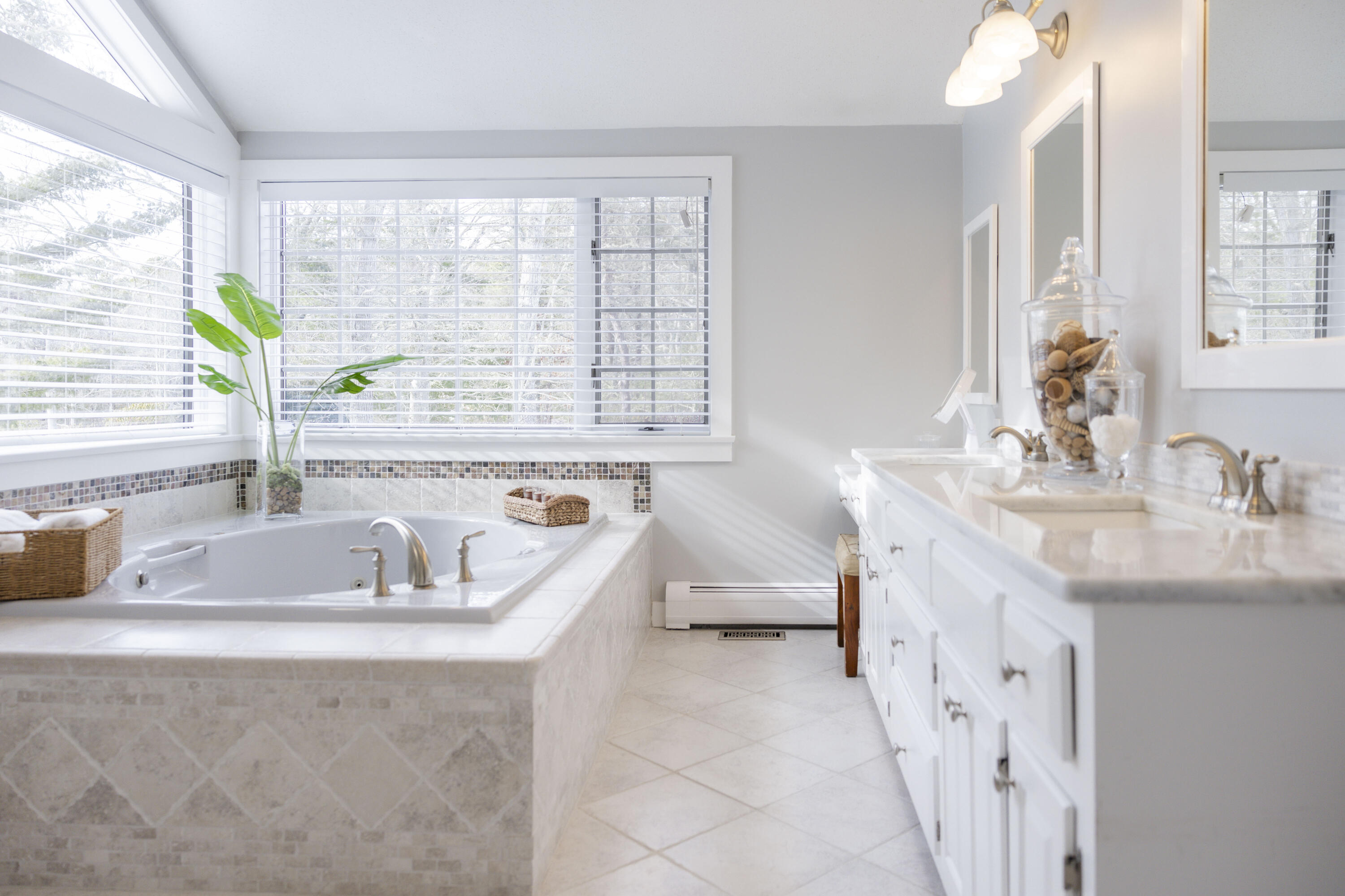 98 Bunker Hill Road Osterville, MA 02655 - Photo 47 of 88 a bathroom with a granite countertop sink and a window