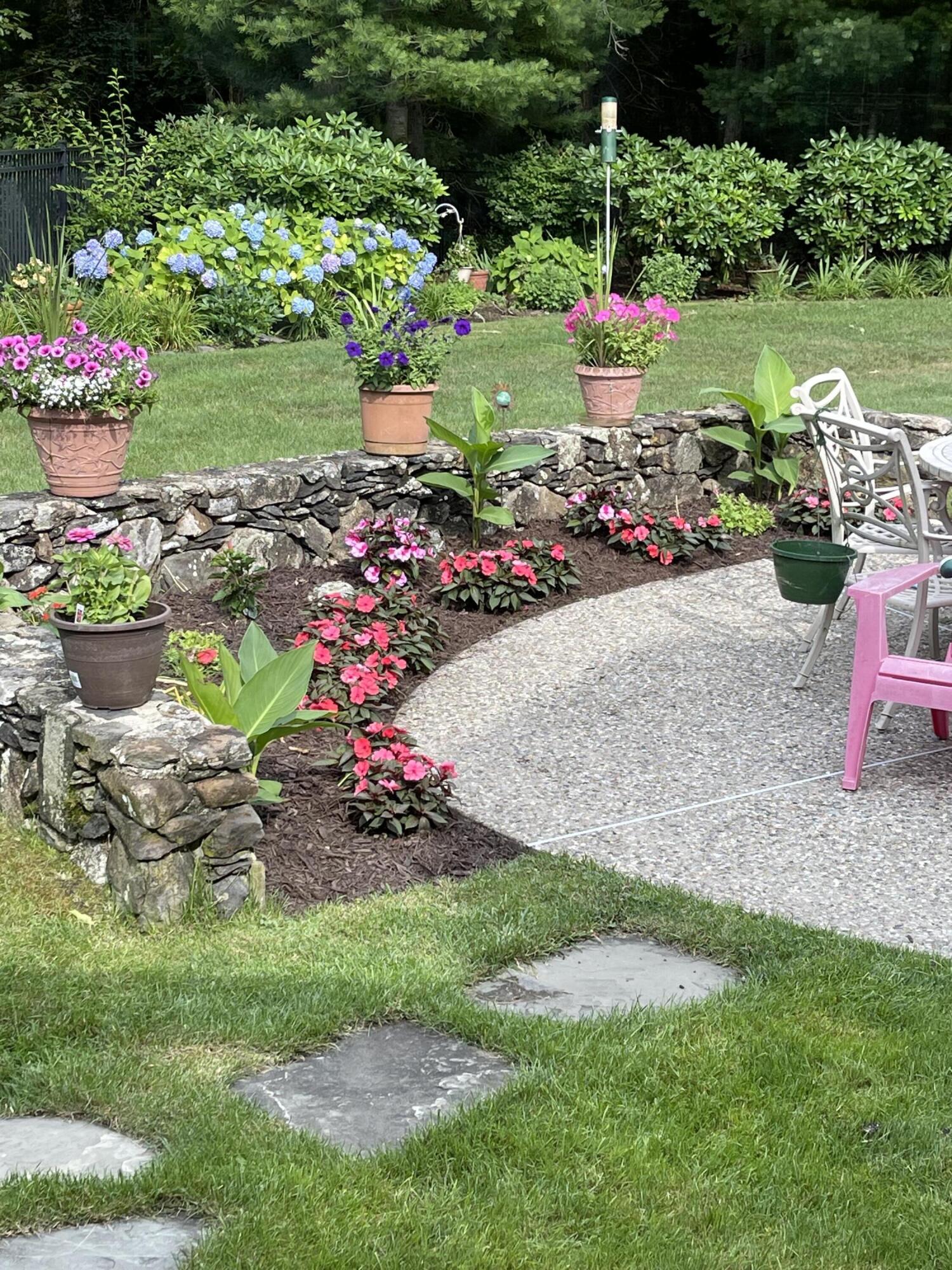 98 Bunker Hill Road Osterville, MA 02655 - Photo 87 of 88 a bunch of flowers are in a garden