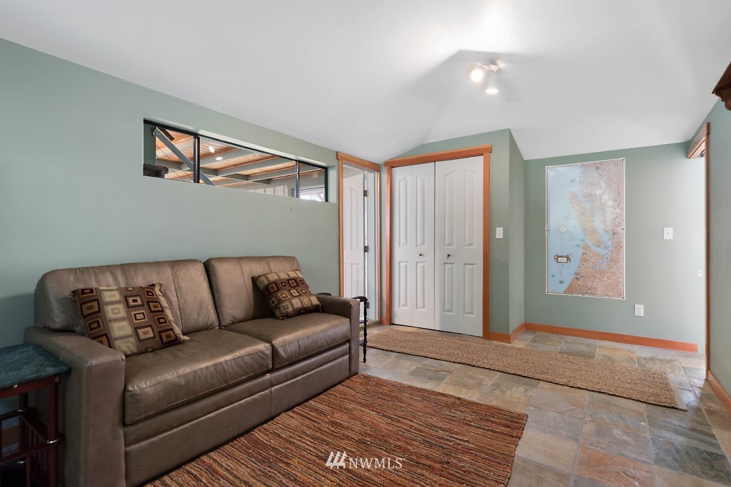 5036 Scurlock Road Freeland, WA 98249 - Photo 15 of 25 a living room with furniture and a rug