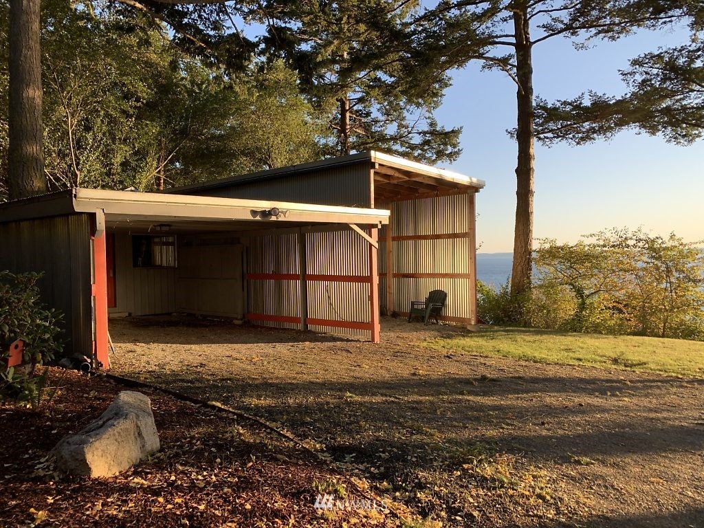 5036 Scurlock Road Freeland, WA 98249 - Photo 24 of 25 a view of a house with a yard