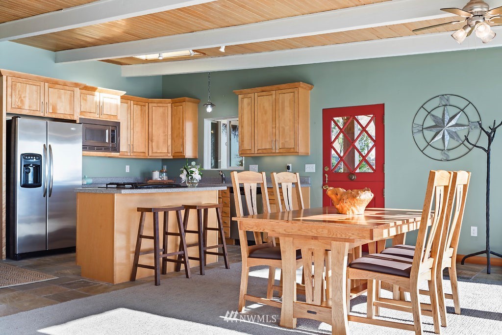 5036 Scurlock Road Freeland, WA 98249 - Photo 5 of 25 a dining room with furniture and window